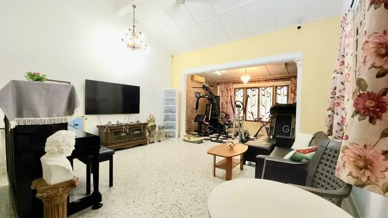 Living features: white painted walls, exposed ceiling beams, pendant light fixture, large flat-screen TV, wooden TV console, decorative statue, sofa with cushions, coffee table, exercise equipment, large windows with curtains, textured flooring; style: contemporary.
