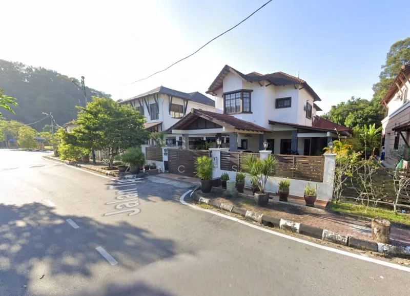 Exterior type: detached bungalow; features: white painted facade, pitched tile roof, two-storey structure, manicured lawn, mature trees, stone-paved walkway, front porch with wooden railing, multiple windows, decorative planters, surrounded by greenery; style: modern.