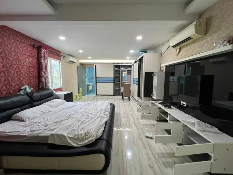 Living features: black leather sectional sofa, white bedding on sofa, wall-mounted TV, white TV console, light-colored laminate flooring, recessed downlights, red textured accent wall, cream wallpaper, window with sheer curtains, air conditioning unit; style: modern.