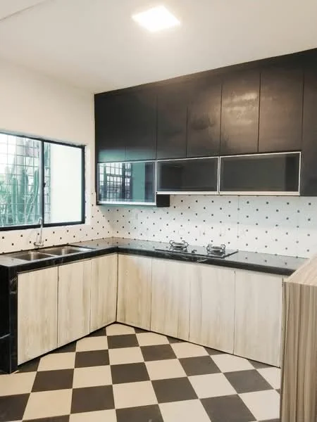 Kitchen features: black cabinetry with glass-front upper cabinets, laminate wood lower cabinets, black granite countertop, double-bowl stainless-steel sink, chrome pull-down faucet, 2-burner gas hob, black and white checkered tile flooring, white walls with black polka dots, window with metal grille, recessed ceiling lights; style: modern; view: garden.