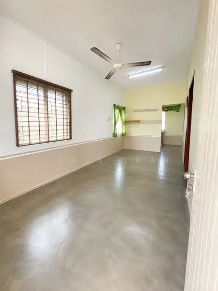 Living features: concrete flooring, white painted walls, ceiling fan, large window with wooden frame, green sheer curtains, open layout, wall-mounted shelf, doorway leading to another room; style: modern.