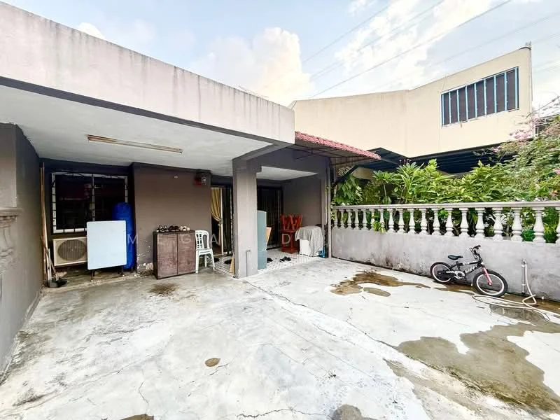 Exterior type: linked terrace house; features: concrete flooring, covered porch area, white painted walls, balustrade with decorative railing, exterior air conditioning unit, outdoor seating area, bicycle parked, landscaped garden in background, adjacent building visible; style: modern.