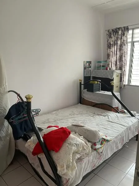 Bedroom features: single bed frame with mattress, bedding with floral pattern, pillow and blanket, black metal bed frame, window with sheer curtains, built-in wardrobe, tiled flooring, clothes rack, decorative items on dresser.