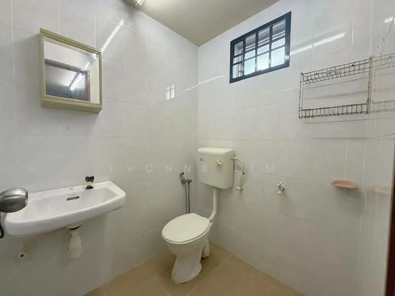 Bathroom features: white tiled walls, cream tiled flooring, single-sink vanity with mirror, one-piece toilet, showerhead, wall-mounted towel rack, window for natural light, light fixture on ceiling.