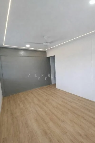 Room features: light wood laminate flooring, white painted walls, grey accent wall, recessed LED downlights, ceiling fan, smooth ceiling, open layout; style: modern.