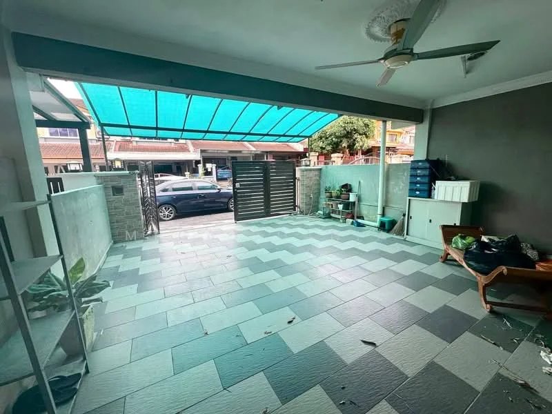 Exterior type: linked terrace house; features: covered outdoor area with awning, grey and white patterned tile flooring, exposed brick wall, sliding gate, manicured plants, car parked in driveway, open space for outdoor seating, decorative wall planters; style: modern.