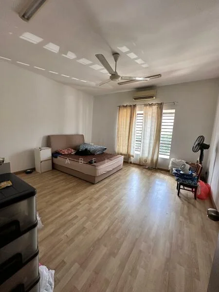 Bedroom features: laminate flooring, white painted walls, 5-blade ceiling fan, window with sheer curtains, double bed with mattress, nightstand, air conditioning unit, freestanding fan, clothes on the floor, plastic storage drawers, decorative items on the floor.