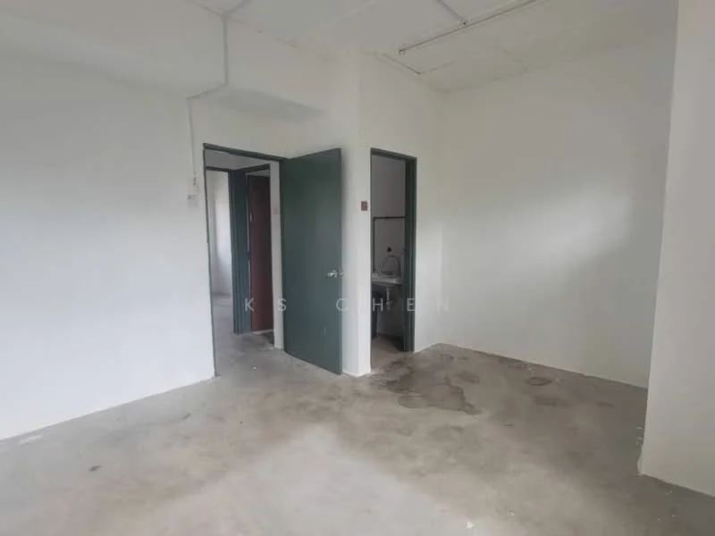 Room features: white painted walls, concrete flooring, two doorways, one visible bathroom door, natural light from window, unfinished ceiling, no visible fixtures or furniture; style: minimalist.