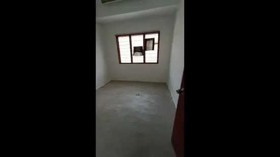 Room features: white painted walls, concrete flooring, single window with wooden frame, door with wooden finish, no visible ceiling features, no visible lighting fixtures, no visible furniture or decor; style: minimalist.