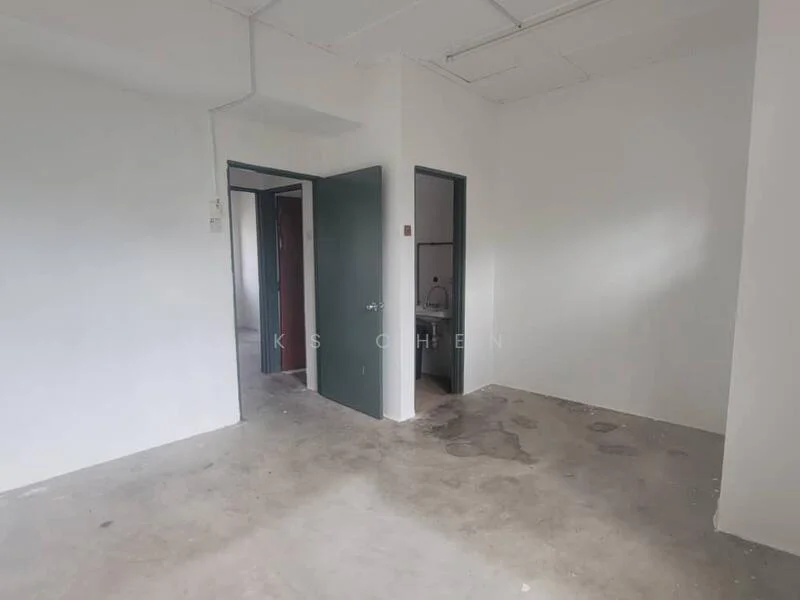 Room features: white painted walls, concrete flooring, single door, two doorways, visible plumbing fixtures, no visible windows, unfinished ceiling, light source from ceiling; style: minimalist.