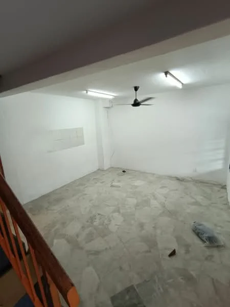Room features: white painted walls, marble flooring, ceiling fan, fluorescent lighting, corner with exposed wiring, empty space, no visible furniture.