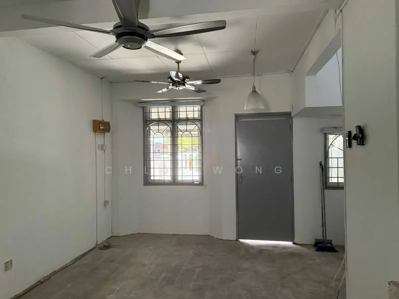 Living features: white painted walls, ceiling fan, pendant light, window with decorative grille, grey door, tile flooring, corner with broom, natural light from window.