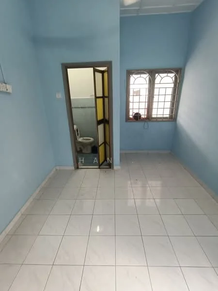 Room features: light blue painted walls, white tiled flooring, window with grid pattern, door with glass panels, visible bathroom door, no visible furniture, neutral ceiling, natural light from window.