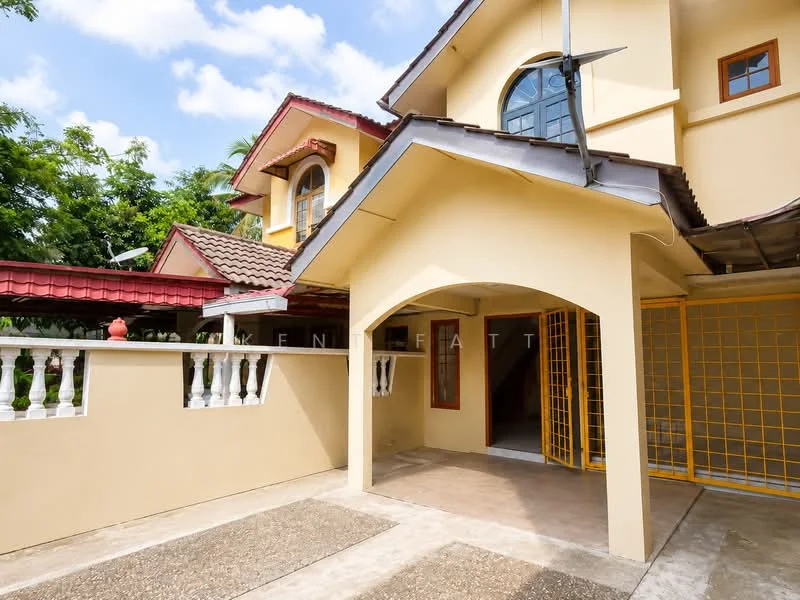 Exterior type: detached bungalow; features: yellow painted facade, gabled roof, red tiled roof, arched entrance, decorative railing, paved walkway, garden area with greenery, window with grid design, security grille at entrance; style: modern.