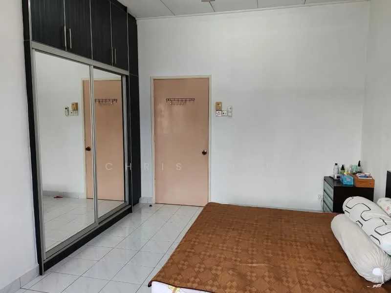 Bedroom features: white painted walls, white tiled flooring, queen-size bed with brown bedspread, built-in wardrobe with mirrored doors, light wood bedside table, single door, wall-mounted hooks, decorative items on bedside table.