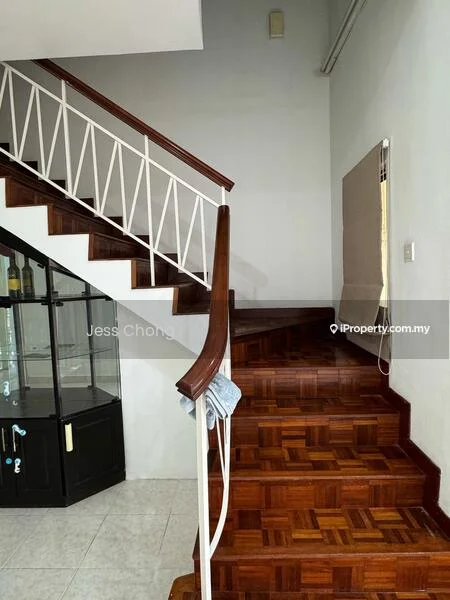 Room features: wooden staircase with handrail, parquet wood flooring, white painted walls, glass display cabinet, natural light from window, staircase landing, light fixture on wall, window treatment; style: modern.