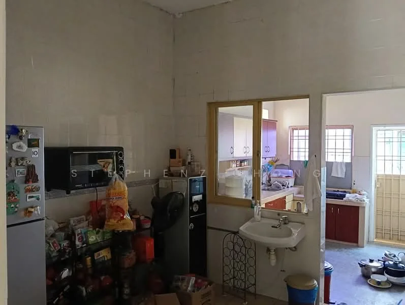 Kitchen features: white tiled walls, grey tiled flooring, single-bowl stainless-steel sink, chrome faucet, built-in microwave, freestanding fridge, kitchen cabinets with red finish, countertop with open space, various kitchen appliances, open shelving, window with grid pattern, door leading to another room.