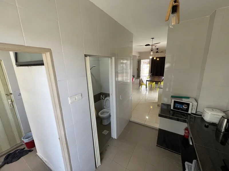 Room features: white tiled walls, grey tiled flooring, black countertop, stainless-steel kettle, microwave, toilet in separate room, doorway to another room, ceiling light fixture, ceiling fan, open layout to living area; style: modern.