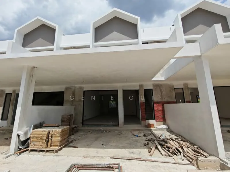 Exterior type: linked terrace house; features: unfinished facade with grey painted walls, flat roof with gabled ends, open front area, concrete flooring, exposed brick wall sections, large windows, construction materials visible on site, surrounding construction debris; style: modern.