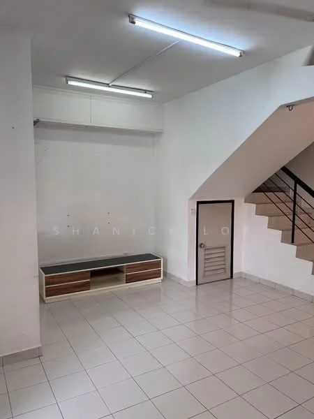 Room features: white painted walls, tile flooring, staircase with metal railing, built-in TV console, fluorescent ceiling lights, door with metal grille, open layout, neutral color scheme; style: modern.