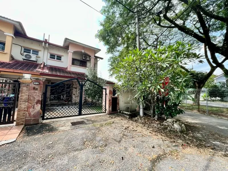 Exterior type: semi-detached house; features: brick facade, red tiled roof, gated entrance, manicured landscaping, mature trees, stone-paved driveway, front porch area, visible air conditioning units, fenced perimeter; style: modern.