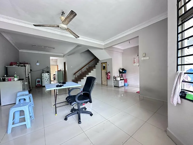 Living features: white painted walls, polished ceramic tile flooring, 5-blade ceiling fan with light, dining table with chairs, office chair, staircase leading to upper floor, refrigerator, kitchenette area visible, window with grill, light fixture on ceiling; style: modern.