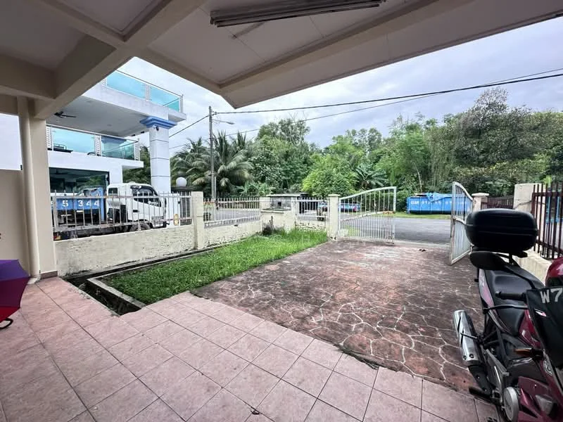 Exterior features: paved driveway, manicured lawn, fenced perimeter, gated entry, surrounding greenery, two-storey building in background, parking space for motorcycle; style: modern.