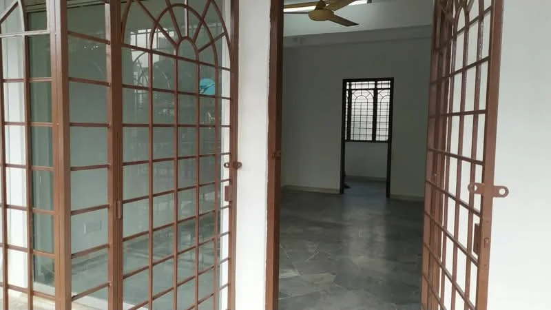 Room features: double wooden doors with decorative grille, grey stone flooring, white painted walls, window with grille, ceiling fan, natural light from windows; style: modern; view: garden.