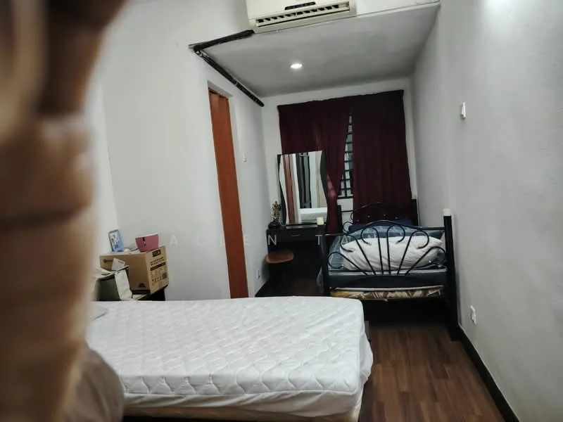 Bedroom features: wooden flooring, white painted walls, 1 window with red curtains, 1 wall-mounted split AC, double bed with metal frame, mirror on dresser, desk with chair, box storage, small bedside table.