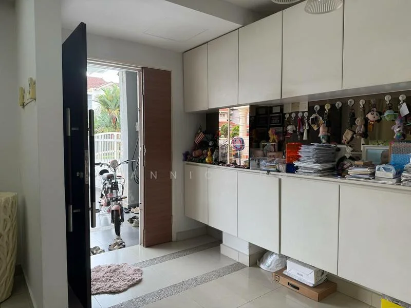Room features: white cabinetry, light grey countertop, cream tiled flooring, wall-mounted hooks, decorative wall with stuffed toys, open doorway leading outside, bicycle visible in doorway, natural light from doorway, decorative items on countertop; style: modern; view: garden.