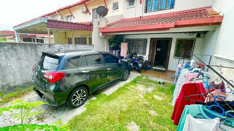 Exterior type: linked terrace house; features: car porch with interlocking pavers, green lawn, stone-paved walkway, exposed brick wall, red tiled roof, front entrance with security grille, outdoor clothes drying rack, visible parked car, bicycle parking area; style: modern.