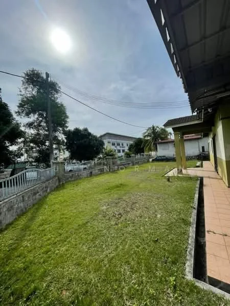 Exterior features: manicured lawn, mature trees, paved walkway, fenced perimeter, single-storey building, sunny outdoor area.