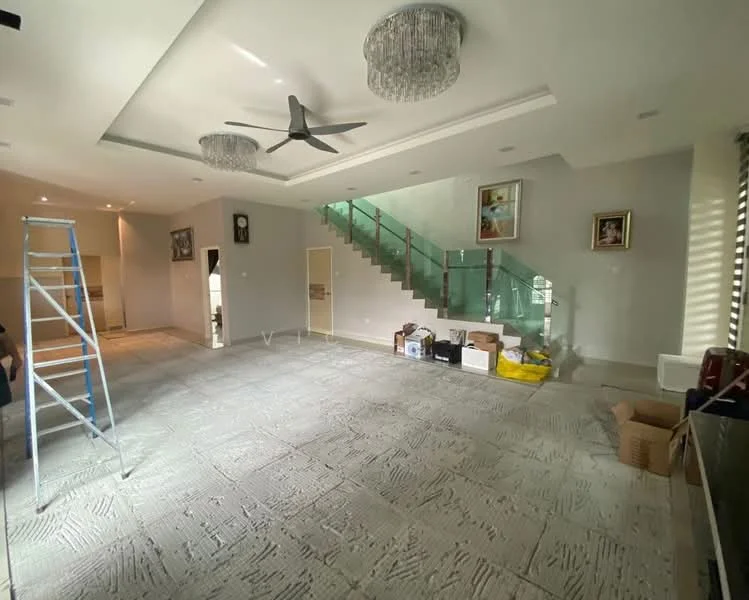 Living features: grey patterned flooring, tray ceiling with recessed lighting, 5-blade ceiling fan, two crystal chandeliers, large glass staircase railing, wall-mounted artwork, large windows with blinds, open layout; style: modern. Room features: staircase with glass railing, empty space for furniture, construction materials visible.