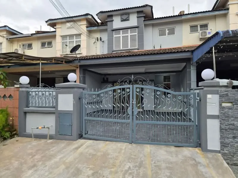 Exterior type: linked terrace house; features: grey painted facade, gated entrance with decorative metalwork, two round white lamps at entrance, car porch with concrete flooring, roof overhang, multiple air conditioning units visible, stone cladding on lower wall, satellite dish on roof, manicured landscaping, driveway with interlocking pavers; style: modern.