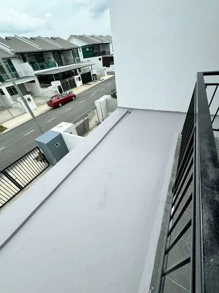 Room features: balcony, grey flooring, metal railing, view of street, surrounding residential buildings; view: street.