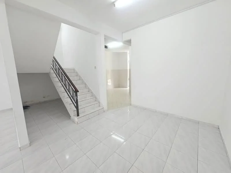 Room features: white painted walls, glossy white tile flooring, staircase with metal railing, open layout, natural light from windows, no visible furniture, neutral color scheme, high ceiling; style: modern.