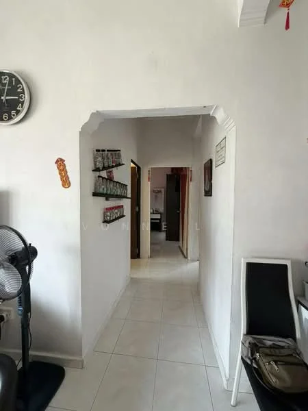 Room features: white painted walls, white tiled flooring, arched doorway, wall clock, shelves on wall, ceiling with decorative molding, fan, doorway leading to other rooms.