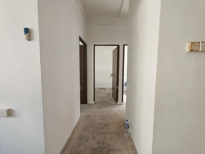 Hallway features: white painted walls, concrete flooring, wooden doors, door frames, light switch, power outlet, water bottle, unfurnished space.
