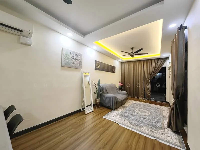 Living features: laminate flooring, cream painted walls, tray ceiling with recessed lighting, 5-blade ceiling fan with light, sofa covered with grey throw, decorative area rug with geometric pattern, wall-mounted air conditioning unit, curtains in dark brown, wall art with family gathering theme, floor lamp, wooden door, light switch, decorative wall panel; style: modern.