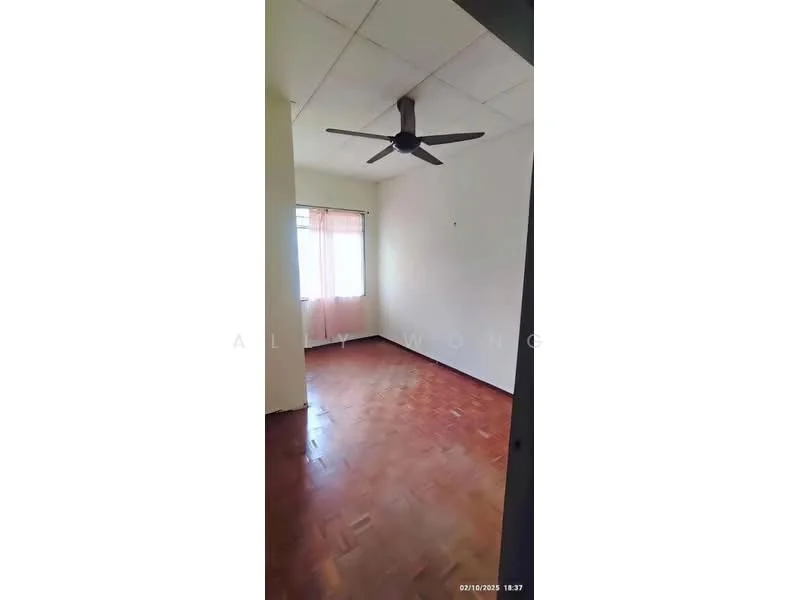Room features: wooden flooring, white painted walls, ceiling fan, window with sheer curtains, light-colored ceiling, corner room, no visible furniture.