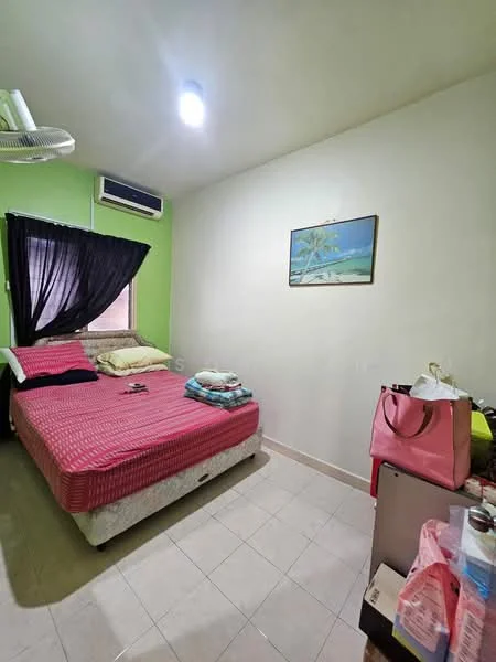Bedroom features: queen-size bed with red bedding, green painted walls, white ceiling, floor-to-ceiling window with black curtains, wall-mounted air conditioning unit, light fixture on ceiling, tile flooring, framed artwork on wall, nightstand with items, clothing and bags on floor.
