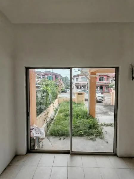 Room features: white painted walls, sliding glass door, floor-to-ceiling windows, tile flooring, visible outdoor garden area, natural light from outside; view: garden.