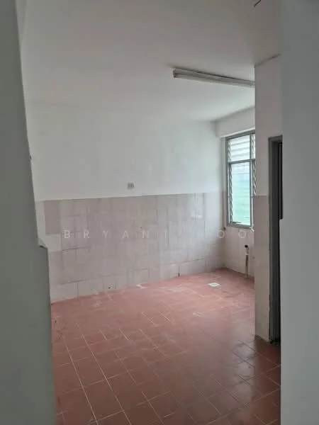 Room features: white painted walls, light grey tiled walls, red ceramic tile flooring, single window, fluorescent ceiling light, corner space, no visible furniture, empty room.