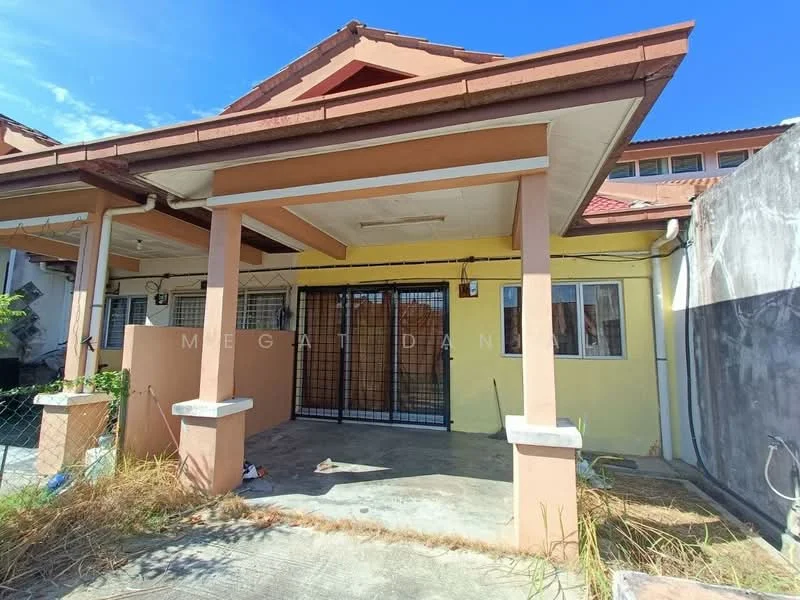 Exterior type: linked terrace house; features: yellow painted facade, gabled roof, front porch with columns, metal gate, concrete flooring, windows with security bars, surrounding overgrown grass, adjacent property visible; style: modern.