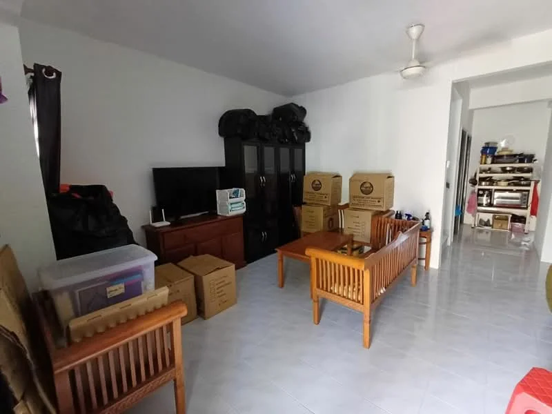 Living features: white painted walls, glossy tile flooring, ceiling fan, wooden coffee table, wooden side tables, black TV console, television, storage boxes, wooden chairs, open layout to hallway.