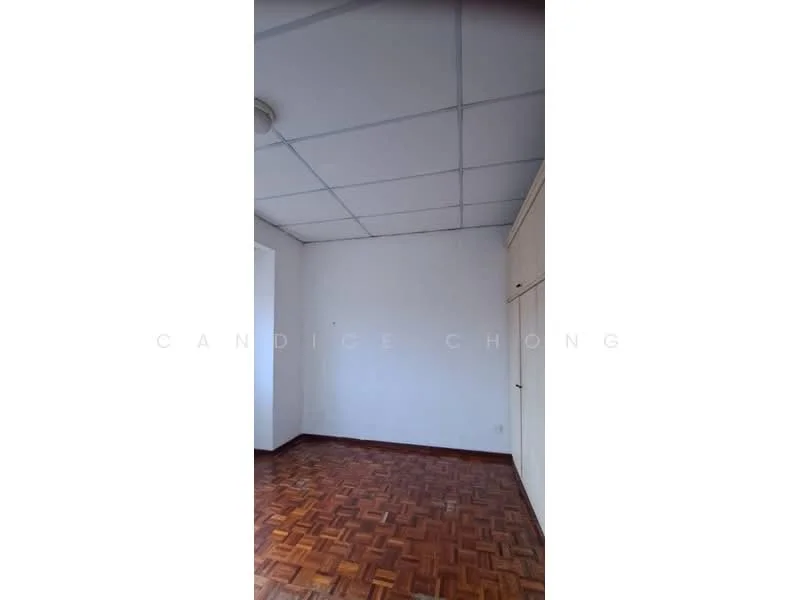 Room features: white painted walls, parquet wood flooring, drop ceiling with lights, built-in wardrobe.
