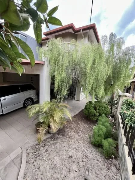 Exterior type: detached bungalow; features: white painted facade, red tiled roof, manicured lawn, mature trees, paved driveway, car porch, landscaped garden, fenced yard; style: modern.