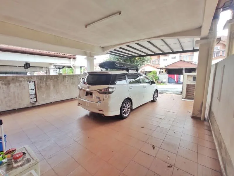 Exterior type: car porch; features: tiled flooring, covered roof, space for vehicle parking, surrounded by walls, access to residential street, nearby landscaping, driveway with interlocking pavers; style: modern.