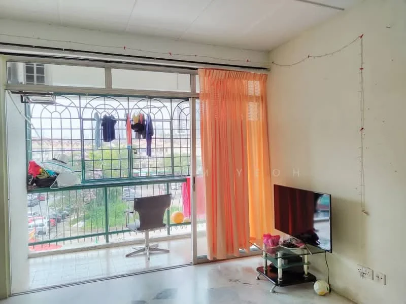 Living features: floor-to-ceiling windows, sliding glass door, orange sheer curtains, TV on stand, decorative table, exposed concrete walls, marble flooring, clothes hanging on balcony railing; view: city.