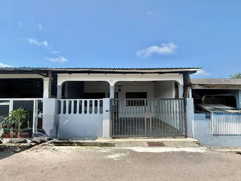 Exterior type: linked terrace house; features: white painted facade, metal gate, concrete porch, roof with overhang, front garden area with potted plants, gravel driveway, single-storey, windows with security bars; style: traditional.